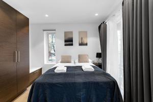 Postel nebo postele na pokoji v ubytování Modern Studio Apartment - Amazing Location