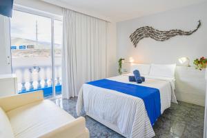 Postel nebo postele na pokoji v ubytování Hostel Neon Tenerife