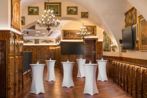 a room with a row of podiums in a church at Iron Gate Hotel & Suites Prague by BHG in Prague