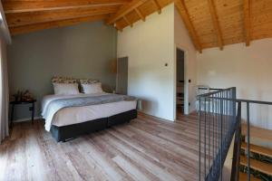 Postel nebo postele na pokoji v ubytování Ermo Loft - Casas do Ermo