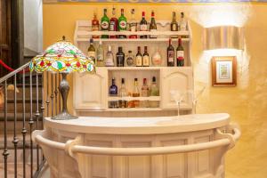 a bar with a lot of bottles of wine at Hotel San Michele in Cortona