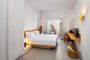 Postel nebo postele na pokoji v ubytování Viva Nove Suites + 31 fotografií