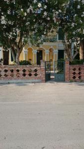 a building with a gate in front of it at House Grabic in Tivat