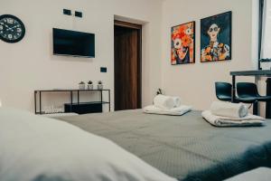 Lova arba lovos apgyvendinimo įstaigoje Appartamento Moderno con SPA Privata eGiardino - Free WiFi