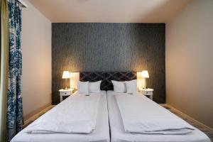Postel nebo postele na pokoji v ubytování Flair Hotel zum Storchen