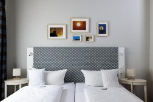 Postel nebo postele na pokoji v ubytování Flair Hotel zum Storchen
