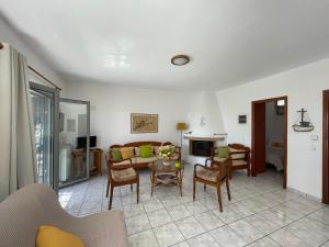 a living room with a couch and a table at Periyali in Keratea