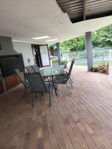 a patio with a table and chairs on it at Bella on St James in Johannesburg