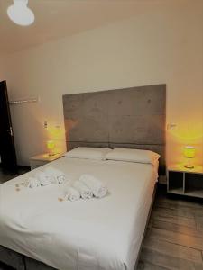 Giường trong phòng chung tại Hotel The Flash - Venturina Terme