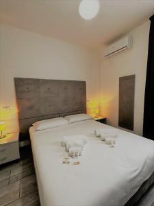 Giường trong phòng chung tại Hotel The Flash - Venturina Terme