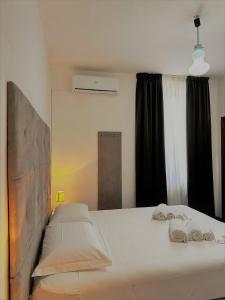 Postel nebo postele na pokoji v ubytování Hotel The Flash - Venturina Terme