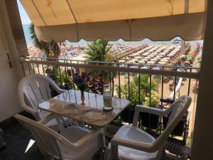 a table and chairs on a balcony with a view at Cozzy hideaway in Durrës in Durrës