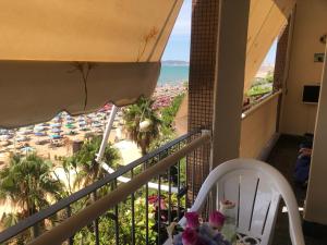 a balcony with a table and a view of the ocean at Cozzy hideaway in Durrës in Durrës