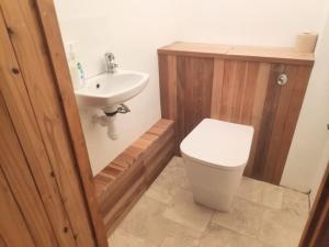 a bathroom with a toilet and a sink at South Devon Luna Bell Tent in Newton Abbot