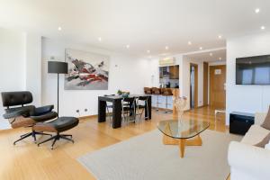 a living room with a table and a dining room at Atico Asante in Arrecife