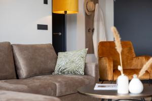 a living room with a couch and a table at Weitblick Winterberg in Winterberg