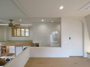 a kitchen with white walls and a large window at Exclusive Penthouse with Great Hanok Village View in Seoul