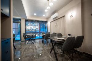 a dining room with tables and chairs and windows at Megalos Galata Hotel in Istanbul +17 photos