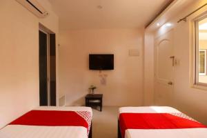 En eller flere senge i et værelse på Villa Tomasa Beach Resort Panglao