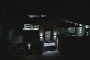 a building with a sign in the dark at The Lofts Luxury Suites in Windhoek