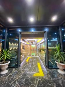 a lobby with a door with a yellow arrow on it at Grand Nergiz Otel in Antalya