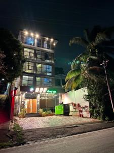un edificio con luci sopra di esso di notte di TGS Dine Inn a Port Blair