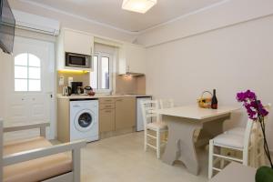 A kitchen or kitchenette at Trefon Hotel Apartments and Family Suites