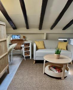 a living room with a couch and a table at Charming apartment in the heart of Madrid in Madrid