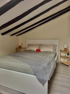 a bedroom with a bed with a red box on it at Charming apartment in the heart of Madrid in Madrid