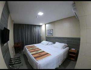 Giường trong phòng chung tại EMA HOTEL