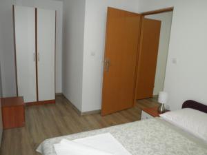 Postel nebo postele na pokoji v ubytování Apartments Sava