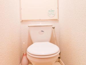 a bathroom with a white toilet in a stall at Studio Valloire, 1 pièce, 3 personnes - FR-1-263-127 in Valloire