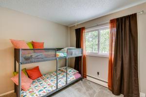 two bunk beds in a room with a window at Anchorage Home about 7 Mi to Chugach State Park! in Anchorage