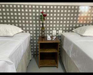 Un ou plusieurs lits dans un hébergement de l'établissement EMA HOTEL
