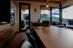 a room with a table with a laptop on it at An Webers Stoag in Geisingen