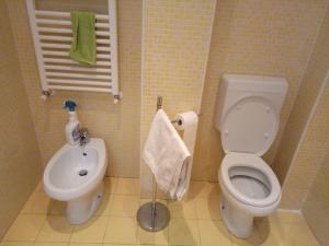 a small bathroom with a toilet and a sink at Villetta Alberti in Sanremo +26 photos
