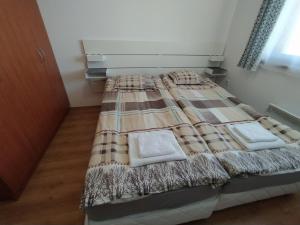 A bed or beds in a room at New Inn