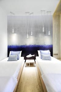 A bed or beds in a room at Privée Santorini