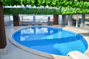 A piscina em ou perto de Gloria Hotel & Suites Doha