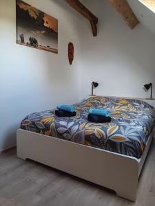 Rúm í herbergi á Le Temps d'un Souffle - Gîte rural 3 épis