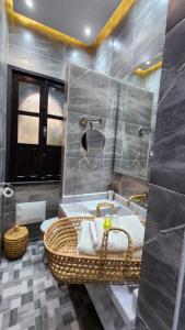 a bathroom with a sink and a bath tub at Dar Salam - All Inclusive - 2023 Best Hospitality Award in Marrakech