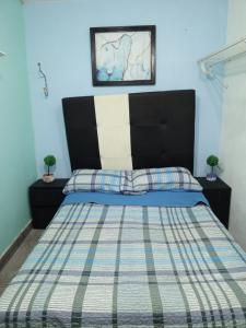 Кровать или кровати в номере Recámara comodísima y pequeña