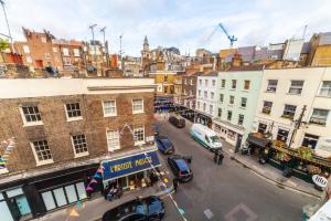 an aerial view of a city street with cars and buildings at Hub townhouse in London