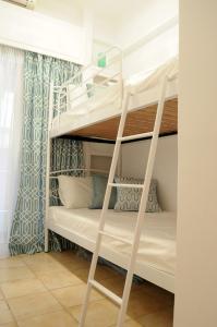 a bunk bed room with two bunk beds at Sunset by the sea 2 in Loutraki