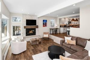 a living room with a couch and a fireplace at 1536-A Deer Blvd in Avon