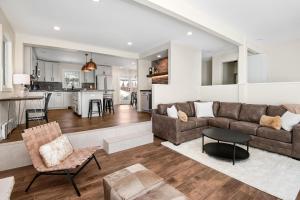 a living room and kitchen with a couch and a table at 1536-A Deer Blvd in Avon