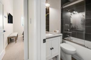 a white bathroom with a toilet and a sink at 1536-A Deer Blvd in Avon +32 photos
