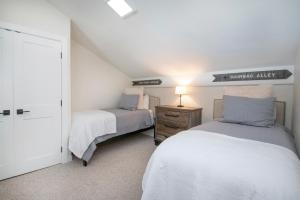 a bedroom with two beds in a attic at 1536-A Deer Blvd in Avon