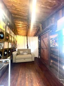 a couch in the middle of a living room in a trailer at Casa Fidelina IV Miraflores de la Sierra in Miraflores de la Sierra