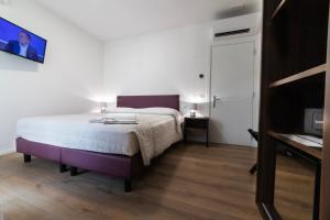 Postel nebo postele na pokoji v ubytování Castelli del Chianti